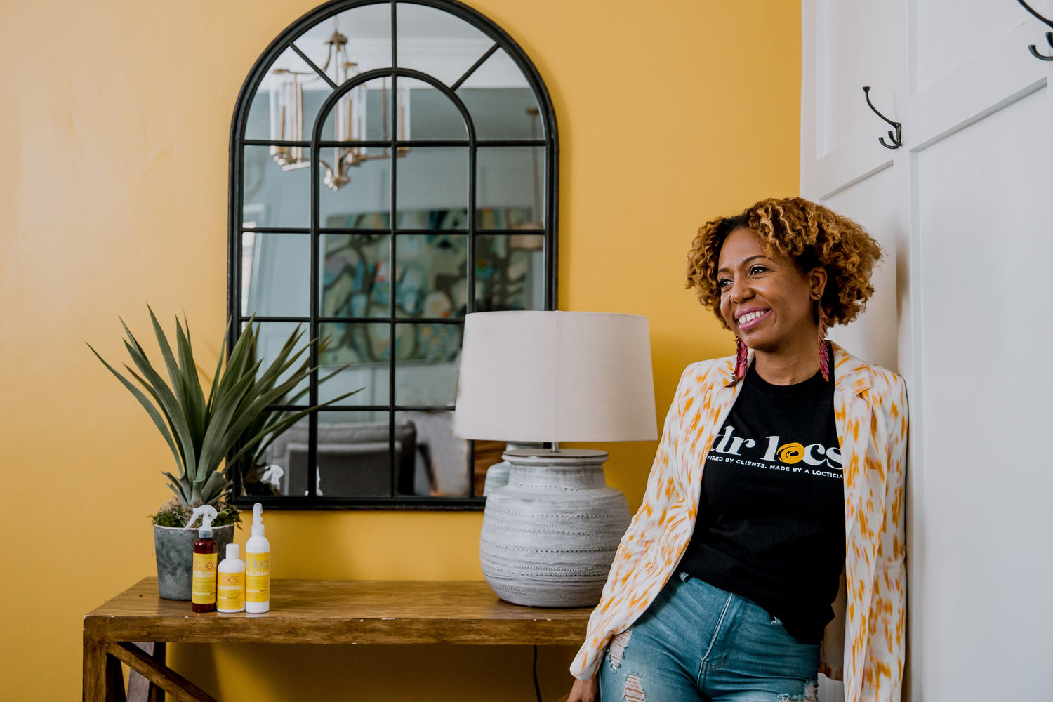 Loctician removing buildup from locs using Dr. Locs Pre-Cleanse detox system